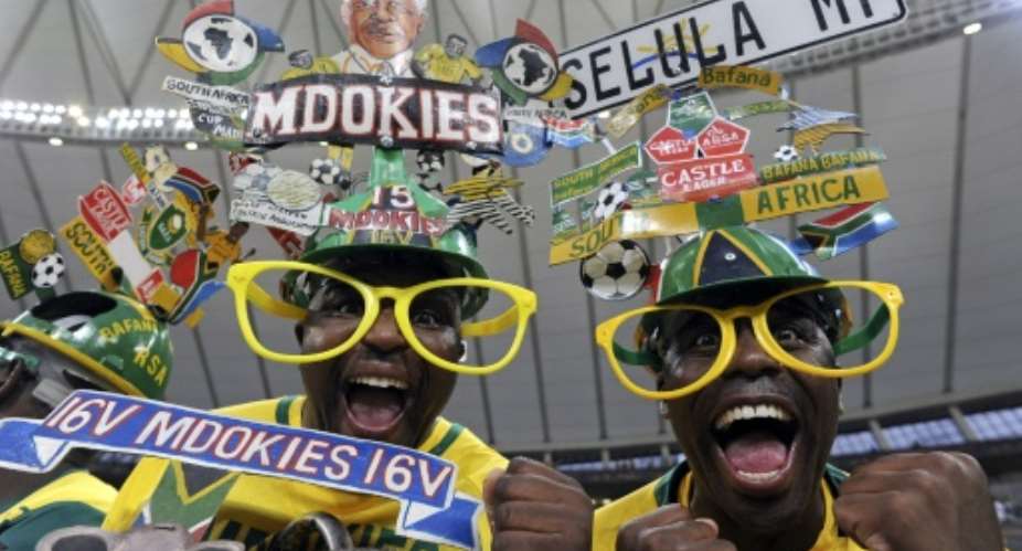Fans of the Bafana Bafana chant slogans before the Africa Cup of Nations matchagainst Morocco in 2013.  By Francisco Leong (AFP/File)