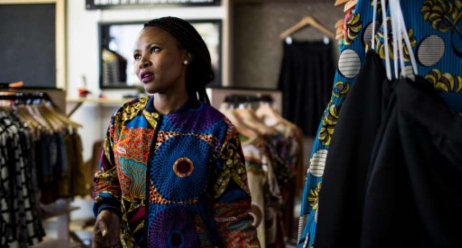 Fashion designer Mandisa Zwane is one of dozens of township entrepreneurs being helped by Soweto's Box Shop not for profit organisation.  By GULSHAN KHAN AFP