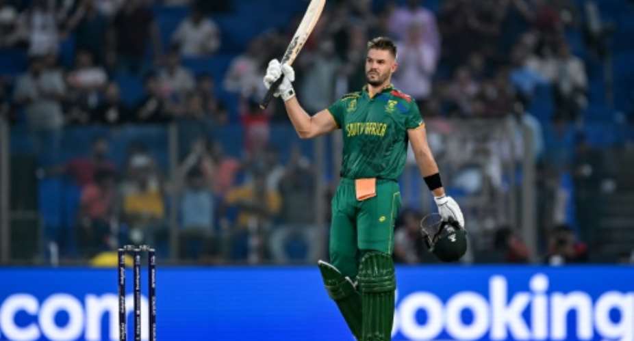 Fast show: South Africa's Aiden Markram celebrates after scoring the fastest ever World Cup century.  By Sajjad HUSSAIN AFP