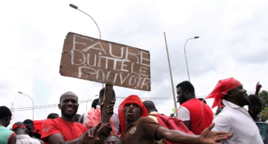 'Faure step down': protesters have been flocking to join a series of massive street protests in Togo which began in August and have shaken the government.  By Matteo Fraschini KOFFI AFPFile
