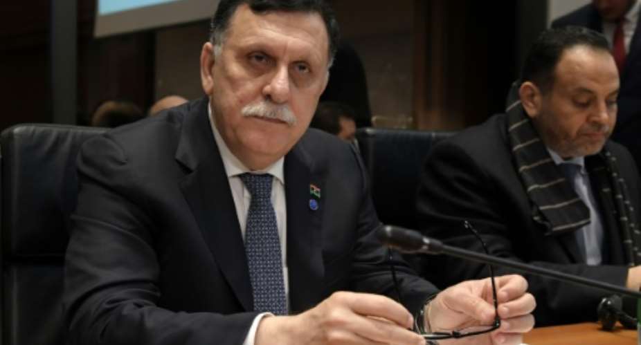 Fayez al-Sarraj, the head of Libya's UN-backed unity government, has announced a new political roadmap for his violence-wracked country, with presidential and parliamentary elections to be held in March 2018.  By TIZIANA FABI AFP
