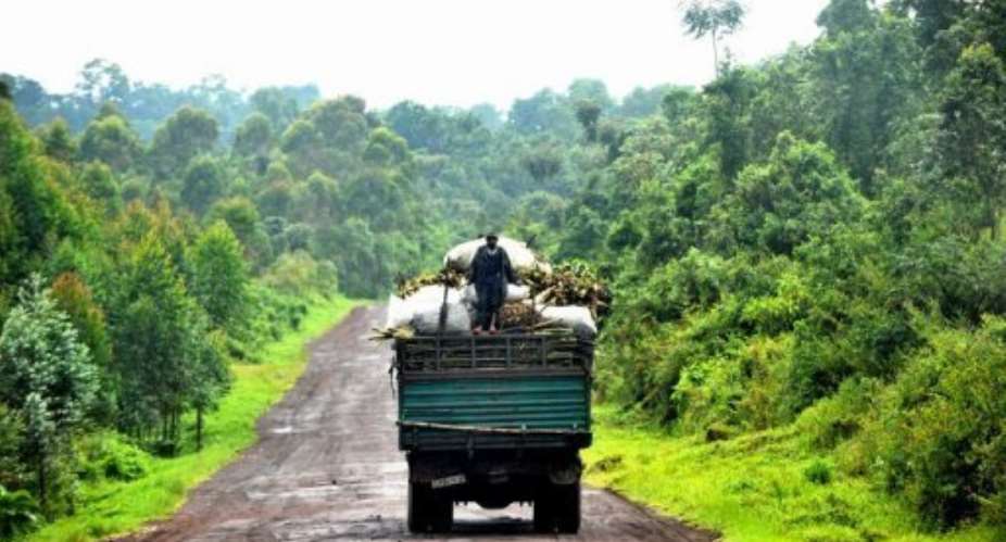 A man stands on the back of a truck in the Democratic Republic of Congo.  By Junior D. Kannah (AFP/File)
