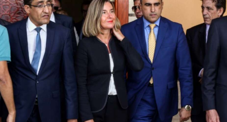 Federica Mogherini C, the EU's High Representative for Foreign Affairs and Security Policy, at Mitiga International Airport, near Tripoli, on July 14, 2018.  By STRINGER AFP