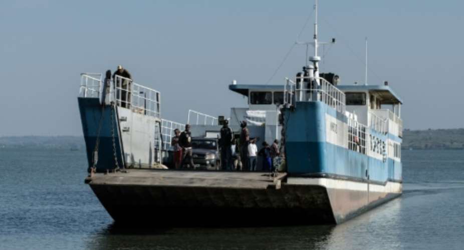 Ferry boats sail across Lake Victoria, which lies within three African countries -- a route that saves passengers an hours-long journey by road.  By Yasuyoshi CHIBA (AFP)