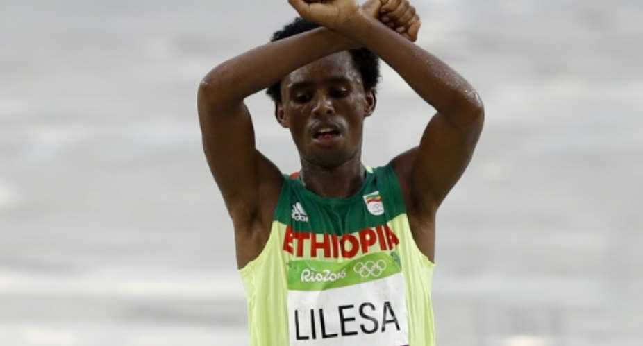 Feyisa Lilesa dramatic crossed-wrist protest made headlines and shone the spotlight on a sometimes brutal government crackdown against Oromo protesters.  By Adrian DENNIS AFPFile