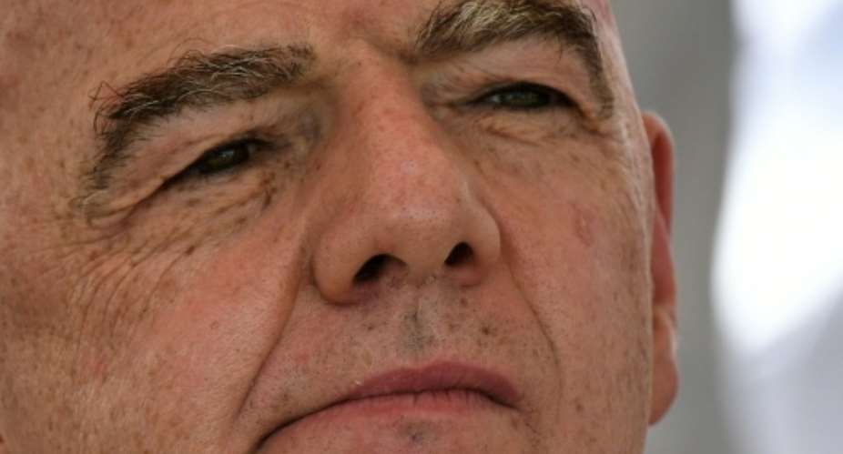 FIFA president Gianni Infantino remains under fire over his aborted plan to allow private investment in the World Cup.  By Jaime SALDARRIAGA (AFP)