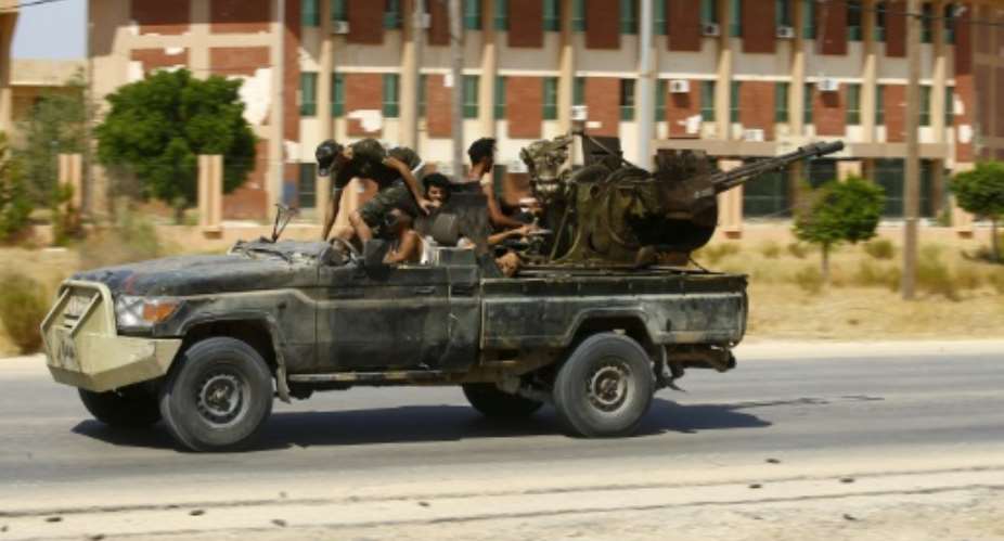 Fighters loyal to the internationally-recognised Government of National Accord are pictured during clashes with forces loyal to strongman Khalifa Haftar, in Espiaa, about 40 kilometers 25 miles south of the Libyan capital Tripoli.  By Mahmud TURKIA AFP