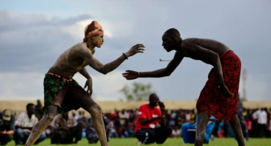 Wrestlers from Jonglei and the Eastern Lakes states take part in the South Sudan National Wrestling Competition for Peace at Juba Stadium.  By Carl De Souza AFP