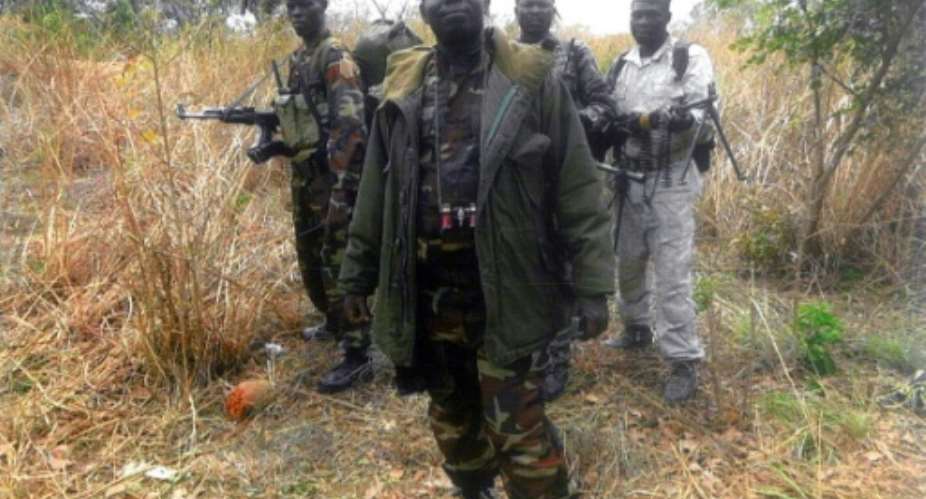File picture of Abdoulaye Miskine with members of his armed group. The photo, which is undated, was published in April 2013.  By - FDPCAFPFile