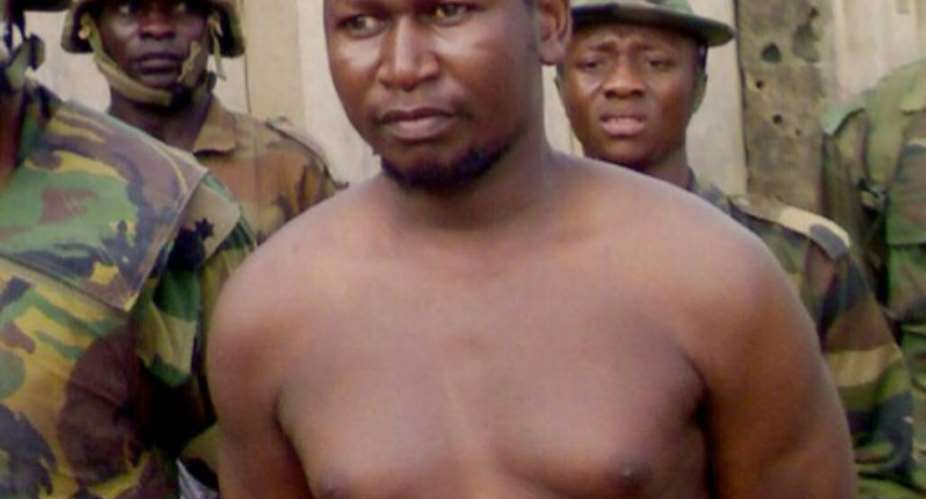 File picture of Boko Haram founder Mohammed Yusuf at Giwa Barracks in Maiduguri on July 30 2009, shortly after his capture by Nigerian troops.  By  AFP