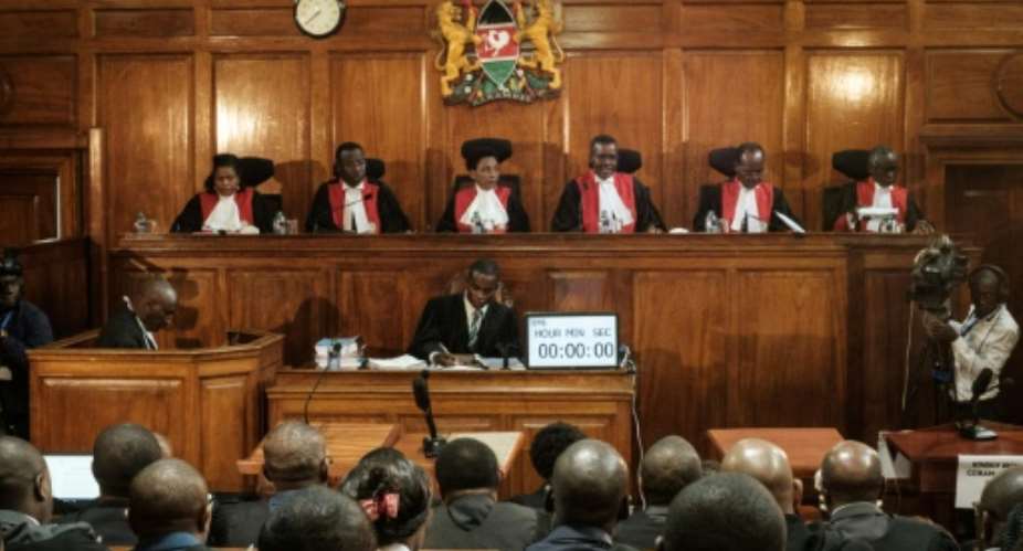 File picture of Kenya's Supreme Court judges at a hearing last November into a complaint over the electoral commission's handling of the repeat elections. Philomena Mwilu is third from the left.  By YASUYOSHI CHIBA AFP