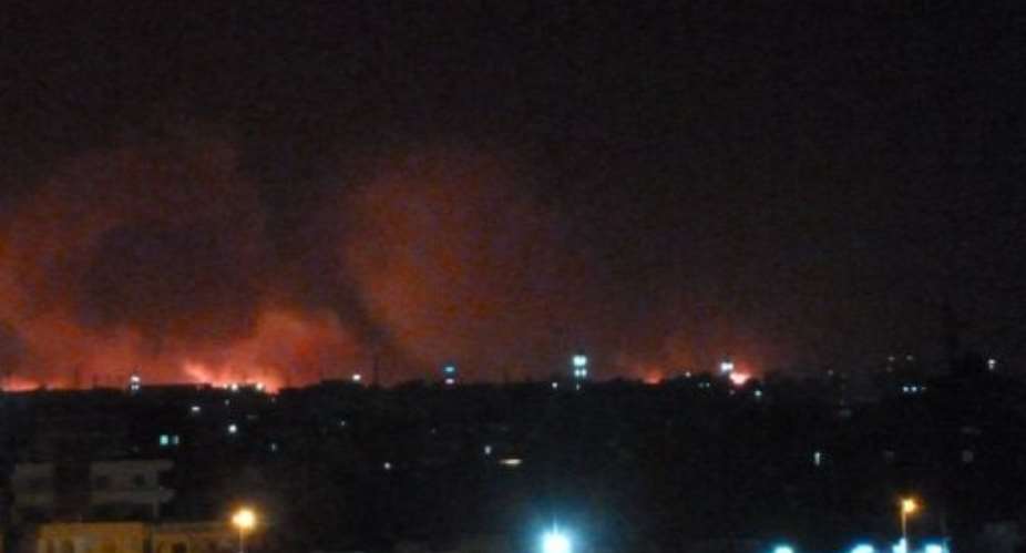 Fire raged and explosions tore through the sky at the Yarmouk military factory in the Sudanese capital Khartoum.  By Ian Timberlake (AFP)