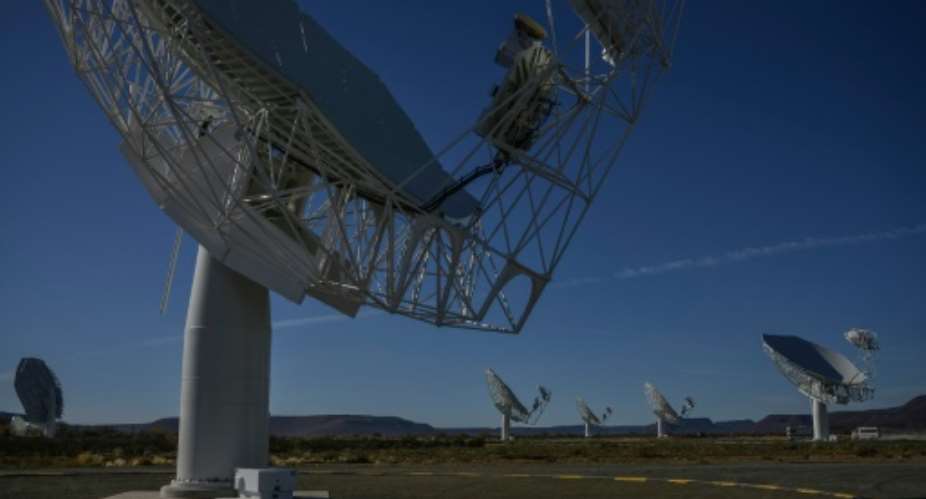 Part of the ensemble of dishes forming South Africas MeerKAT radio telescope is seen in Carnarvon on July 16, 2016.  By Mujahid Safodien (AFP)