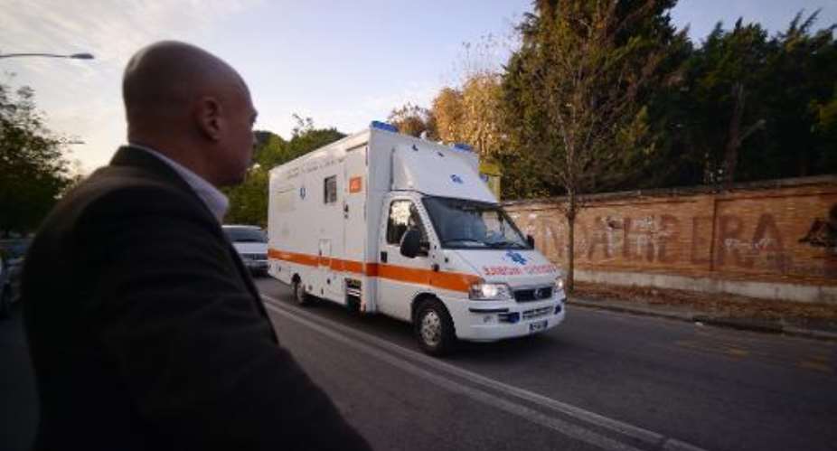 A special ambulance containing an Italian doctor with Ebola arrives at the Lazzero Spallanzani hospital in Rome early on November 25, 2014 after an Boeing KC-767 delivered him to the military airport of Pratica di Mare.  By Filippo Monteforte AFP
