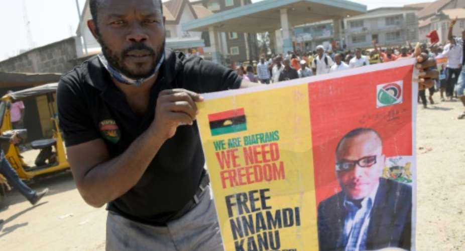 A pro-Biafra supporter holds a poster of jailed activist Nnamdi Kanu during a protest calling for his release in Aba, southeastern Nigeria, on November 18, 2015.  By Pius Utomi Ekpei AFPFile