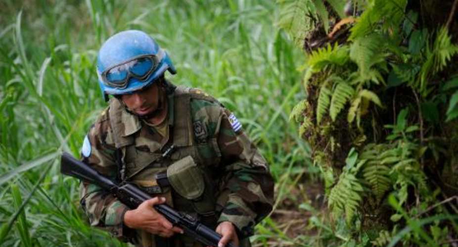 A picture taken on June 3, 2012 shows a peacekeeper from MONUSCO on patrol near the village of Katoyi in North Kivu province.  By Phil Moore (AFP/File)