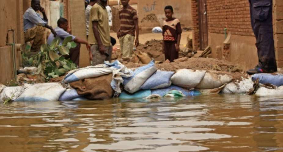 Flood waters from the Nile have swamped the Sudan's Tuti island, wedged between the twin cities of Khartoum and Omdurman, destroying homes and forcing people to flee.  By ASHRAF SHAZLY AFP