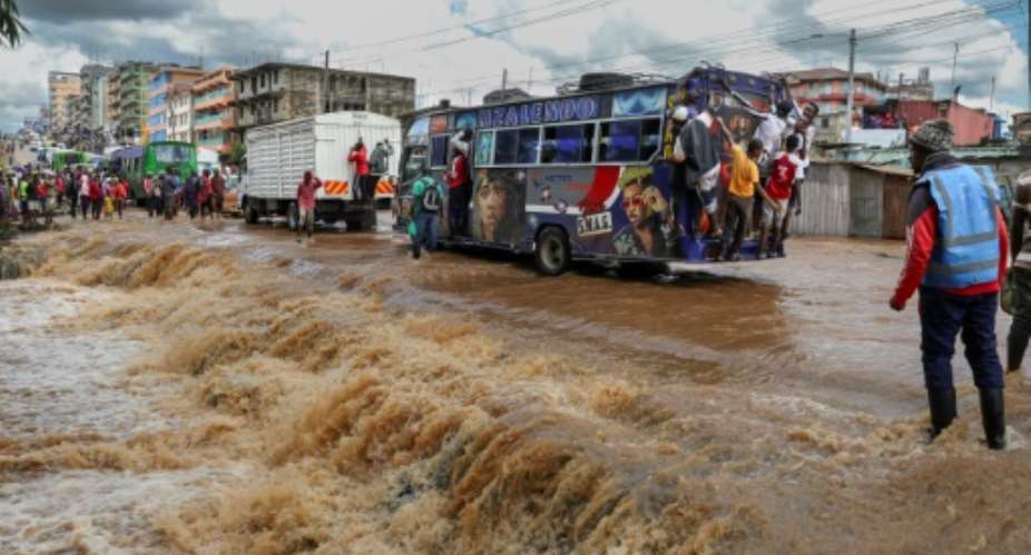 Flooded roads in Nairobi caused traffic chaos.  By Tony KARUMBA AFP