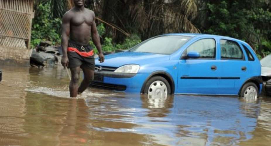Floods in Lagos have turned roads into rivers and forced people out of their homes.  By Pius Utomi Ekpei AFP