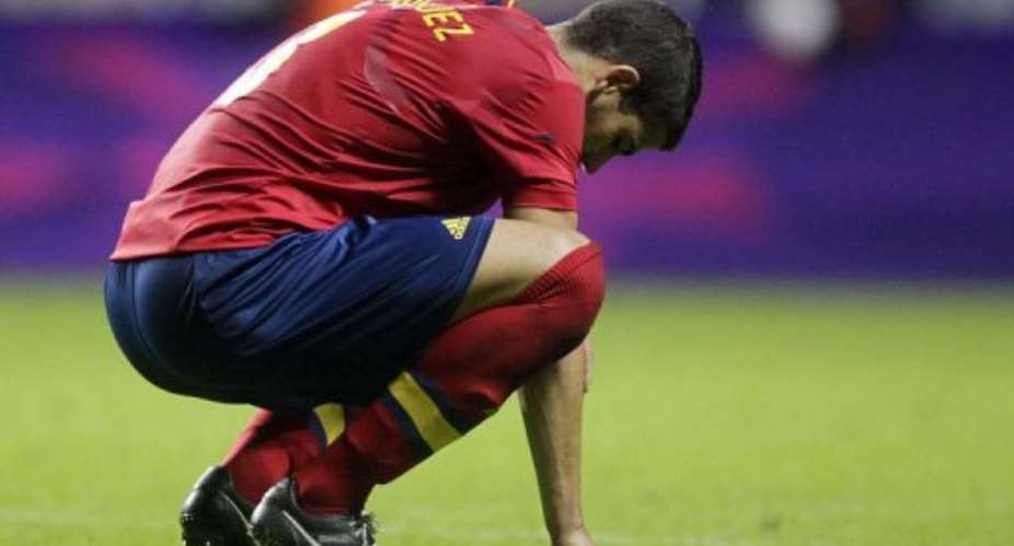 Spain's Alvaro Dominguez reacts after losing 1-0 to Honduras.  By Graham Stuart AFP
