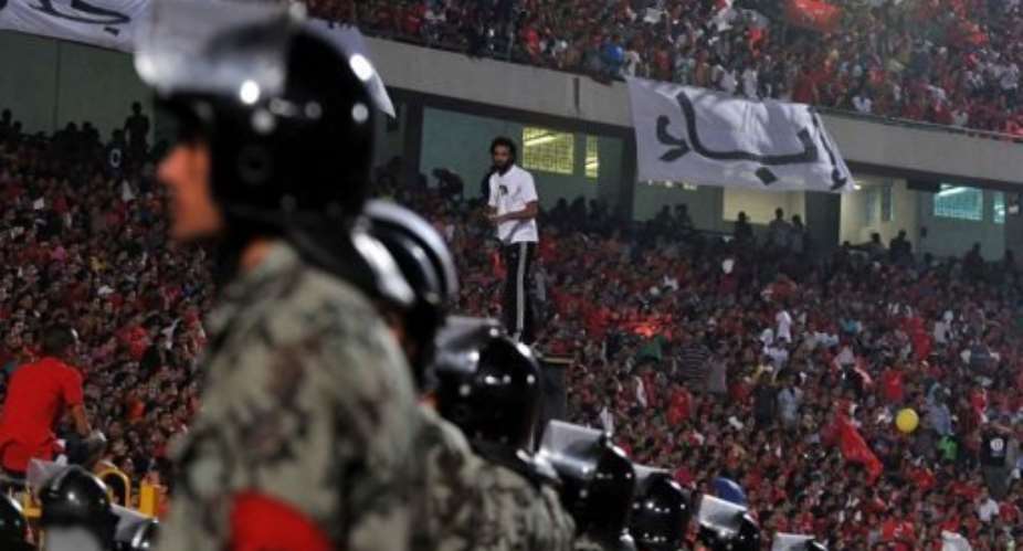 Egyptian soldiers stand guard during an Al-Ahly match in Cairo in 2011.  By Mohammed Hossam AFPFile