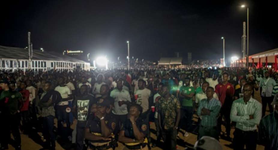 Football-mad Nigerians gather at a fan zone in Lagos to watch their national team play.  By STEFAN HEUNIS AFPFile
