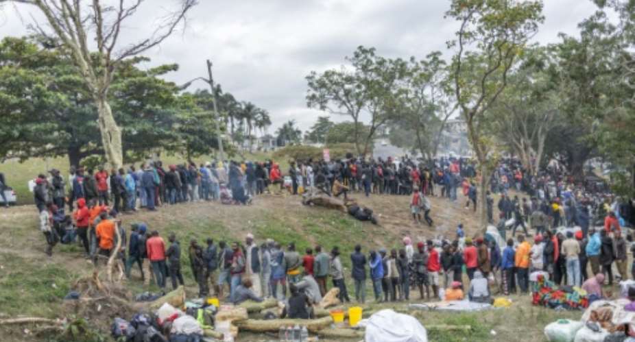 Foreign nationals, many of them Malawians, have streamed to a sports field in Durban, South Africa after fleeing a wave of xenophobic attacks.  By RAJESH JANTILAL (AFP)