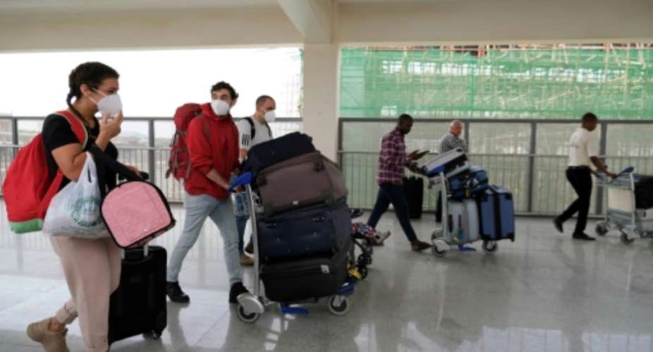 Foreign nationals were flying out of Nigeria's Abuja airport Sunday.  By Kola SULAIMON AFP