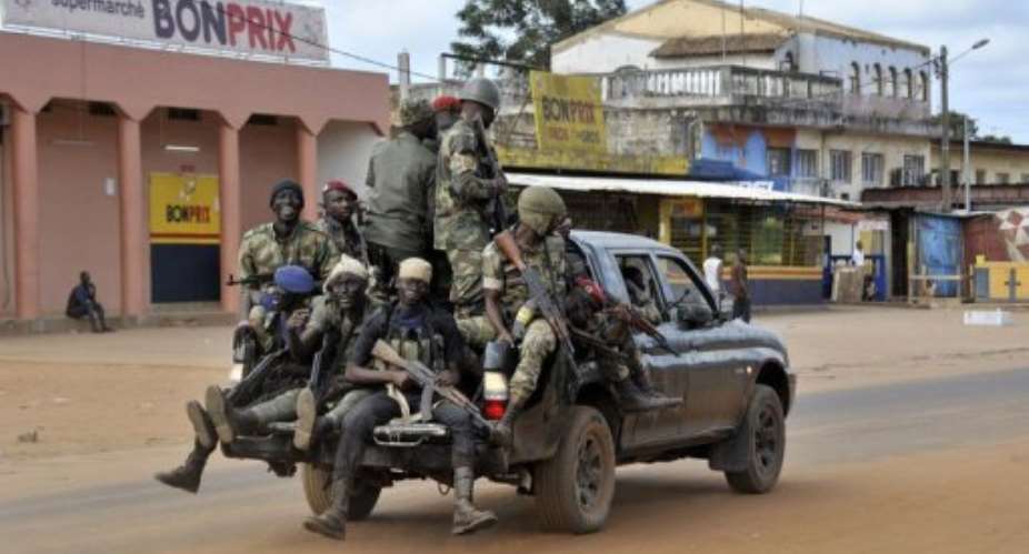 Soldiers of the Ivory Coast Republican Force FRCI patrol the streets of Dabou.  By Sia Kambou AFPFile