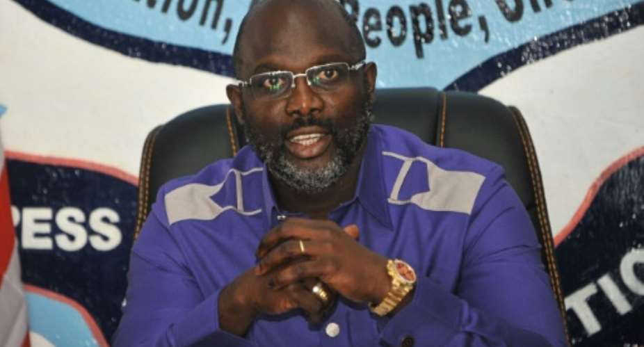 Former international football star George Weah, 51, is due to be sworn in as president of Liberia on January 22, taking over from Ellen Johnson Sirleaf.  By Zoom DOSSO (AFP/File)