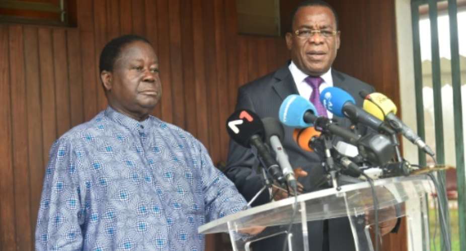 Former Ivorian president Henri Konan Bedie L and and ex prime minister Pascal Affi N'Guessan asked supporters to boycott the electoral process.  By SIA KAMBOU AFP