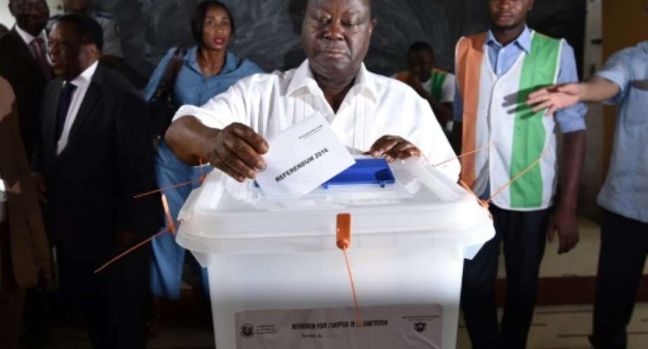 Former Ivory Coast President Henri Konan Bedie casts his vote at a polling station in Abidjan, on October 30, 2016, during a referendum on a new constitution.  By Sia Kambou (AFP)