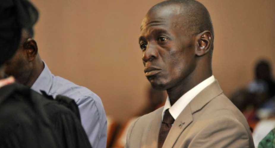 Former Malian army captain Amadou Sanogo, who staged a military coup in Mali in 2012 and is charged with the murder of several soldiers whose bodies were found in a mass grave, attends his trial in Sikasso on November 30, 2016.  By - (AFP/File)
