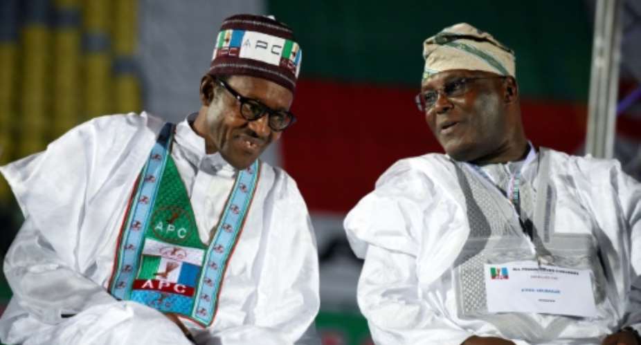 Former military ruler and incumbent Muhammadu Buhari (L) faces off against main rival and former vice president Atiku Abubakar in next weeks election.  By Pius Utomi EKPEI (AFP/File)