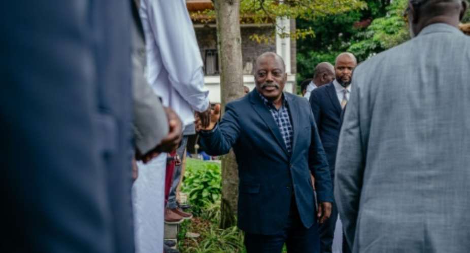 Former president of the Democratic Republic of Congo Joseph Kabila greets traditional leaders after a meeting at one of his residences in Goma on May 30, 2025.  By Jospin Mwisha (AFP/File)