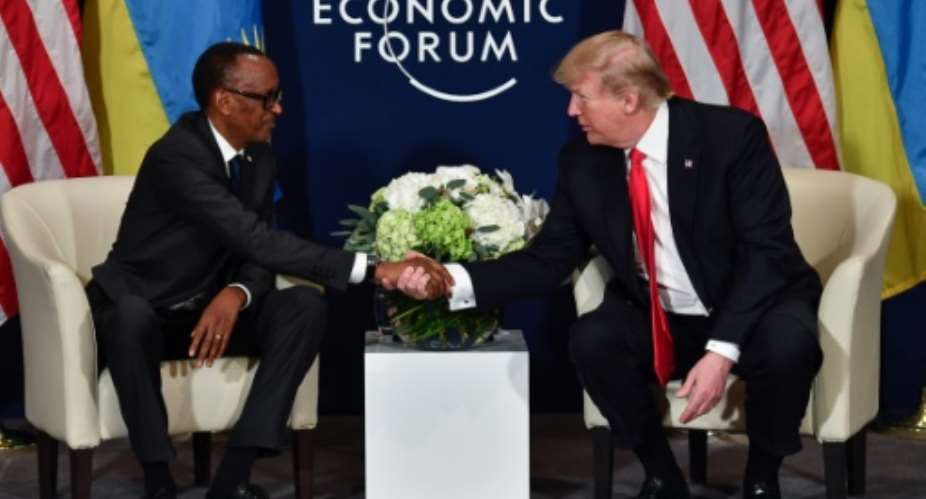 Former US president Donald Trump did not visit Africa during his term, but sometimes met African leaders like Rwanda's Paul Kagame at international events like the 2018 World Economic Forum in Davos.  By Nicholas Kamm AFP