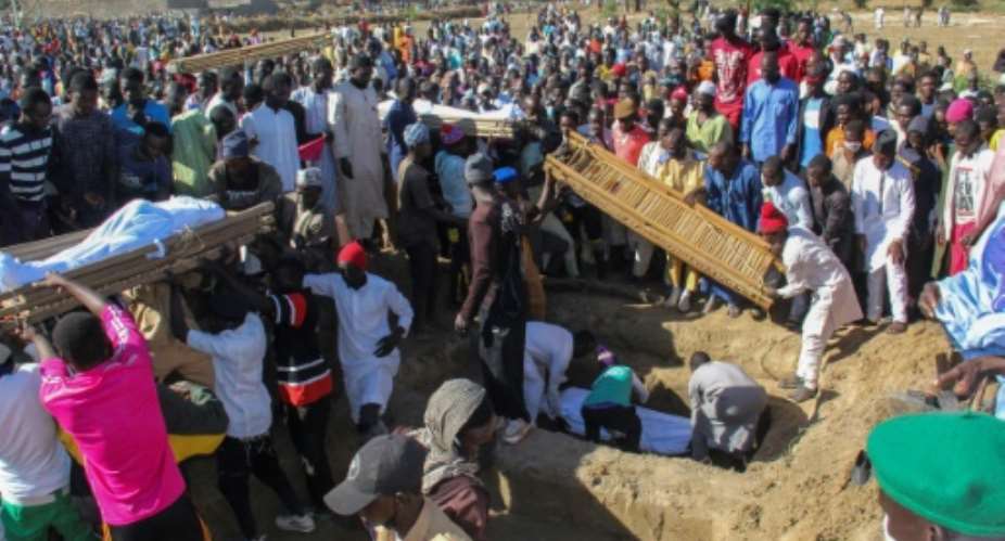 Forty-three farm workers and buried at a mass funeral after the Boko Haram attack in northeastern Nigeria.  By Audu Marte AFPFile