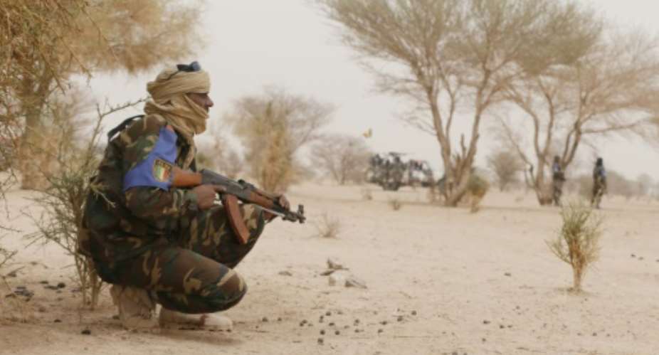 Malian soldiers patrol between Gao and Kidal on July 26, 2013 in northern Mali.  By Kenzo Tribouillard AFPFile