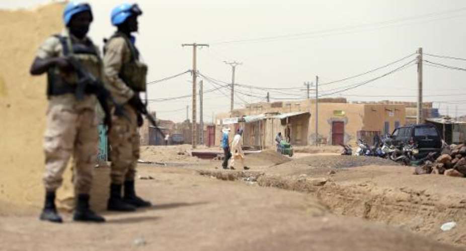 United Nations soldiers patrol on July 27, 2013 in the northern Malian city of Kidal.  By Kenzo Tribouillard AFPFile