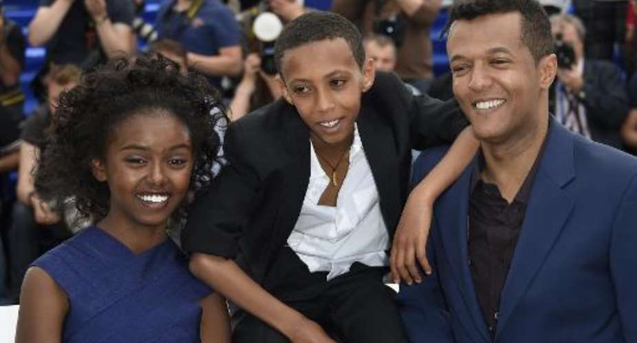 From L Ethiopian actress Kidist Siyum, actor Rediat Amare and director Yared Zeleke pose during a photocall for the film Lamb at the 68th Cannes Film Festival in Cannes, southeast France, on May 20, 2015.  By Loic Venance AFP