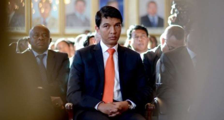 Andry Rajoelina (centre) attends a ceremony at Antananarivo Town Hall, on May 13, 2013.  By Bilal Tarabey (AFP)