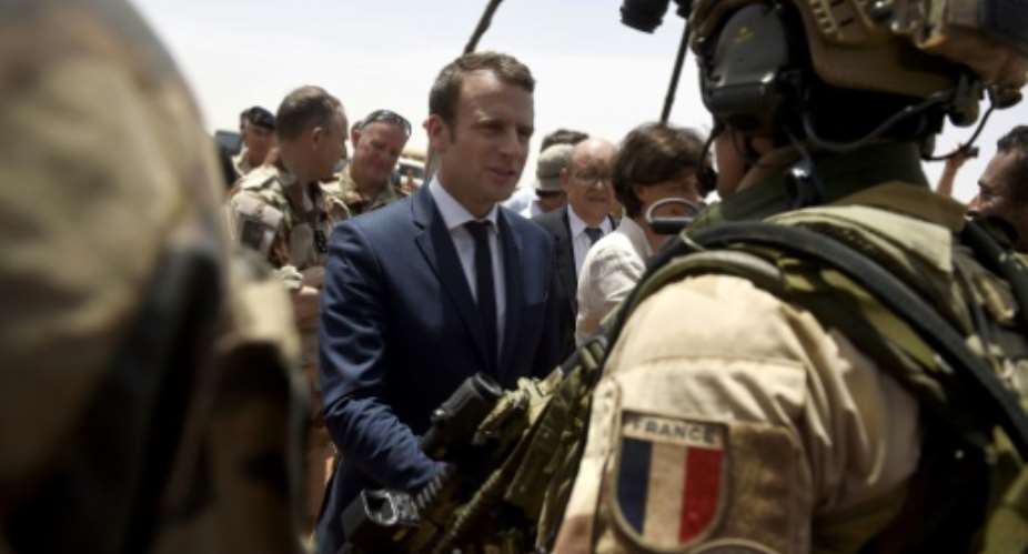 France is attempting to overcome US reservations about financial backing for anti-terrorism forces in the Sahel region of Africa, pictured in May 2017 when French President Emmanuel Macron C, visited the French troops in northern Mali.  By CHRISTOPHE PETIT TESSON POOLAFP
