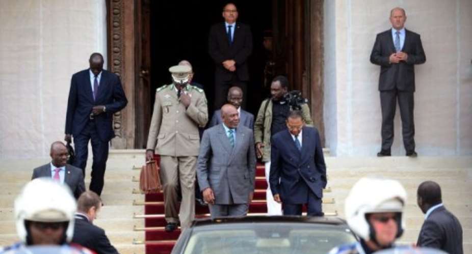 Mali's Prime Minister Cheikh Modibo Diarra C leaves after a meeting with France's foreign minister.  By Martin Bureau AFP