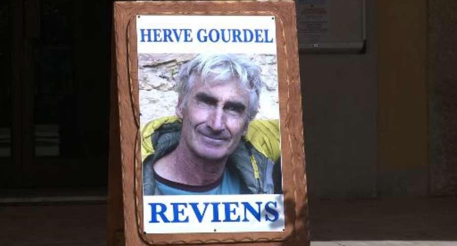 A video screengrab shows a picture of French hostage Herve Gourdel, placed outside the town hall in Saint-Martin-Vsubie, on September 22, 2014.  By  AFP