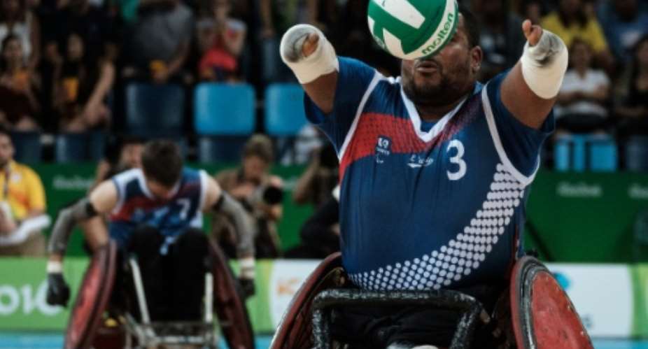 France's Cedric Nankin catches a ball during the 7th-8th classification wheelchair rugby match against at the Rio 2016 Paralympic Games.  By Yasuyoshi Chiba AFP