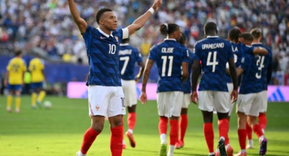 Frances Kylian Mbappe celebrates his teams third goal in a 3-0 victory over Sweden.  By ANGELA WEISS (AFP)