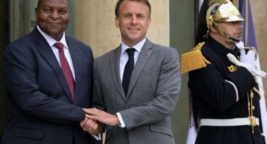 France's President Emmanuel Macron centre and his Centrafrican counterpart Faustin-Archange Touadera left are aiming for a 'constructive partnership', the French leader's office said.  By Bertrand GUAY AFP