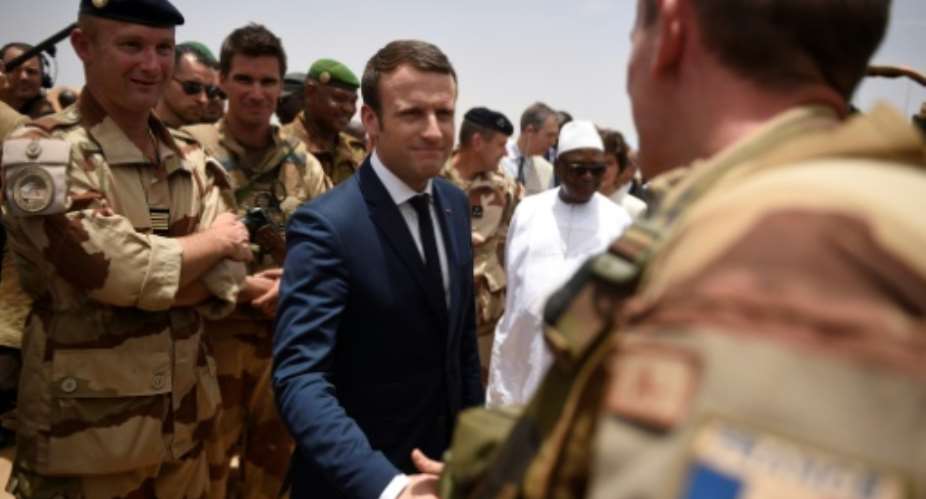 France's President Emmanuel Macron is visiting French troops in Mali on his first official trip outside Europe since taking power at the weekend.  By CHRISTOPHE PETIT TESSON POOLAFP