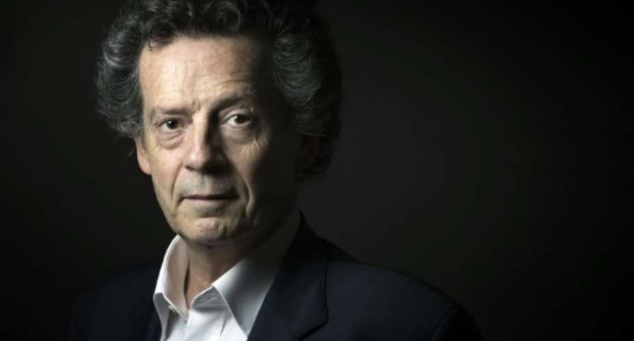 Current favourite for Frances top literary award, the Goncourt, is Les Preponderants (roughly translated as The Principals), written by veteran Franco-Tunisian author Hedi Kaddour, pictured in September 2015, in Paris.  By Joel Saget (AFP/File)