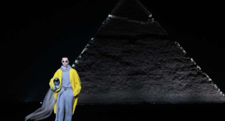French fashion house Dior presented its 2023 fall men's collection in the shadow of Egypt's ancient Giza pyramids on Saturday.  By Ahmed HASAN AFP